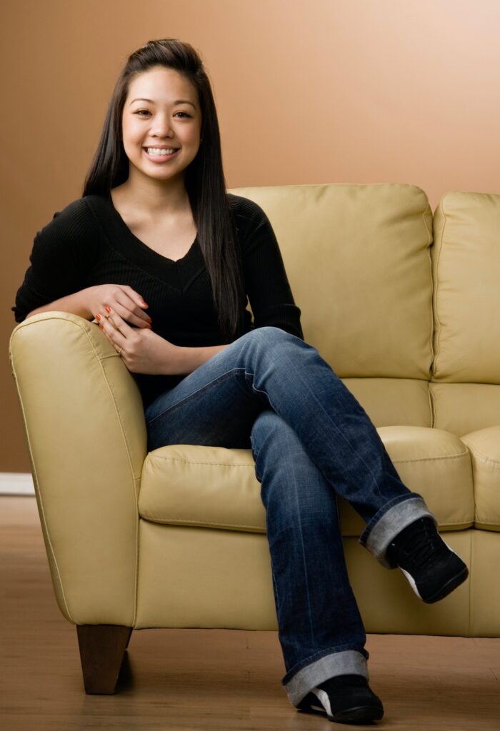 Smiling girl sitting on couch